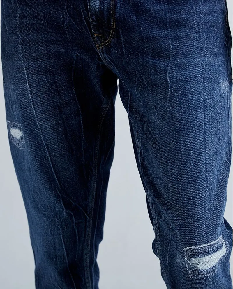 Jean Tapered fit tono medio para hombre