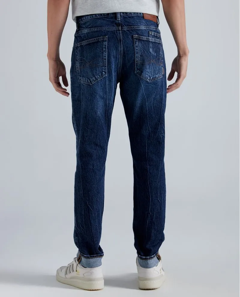 Jean Tapered fit tono medio para hombre